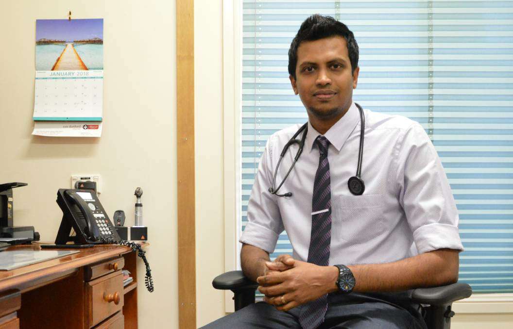 Photograph of Dr Lolitha Basnayake in his office